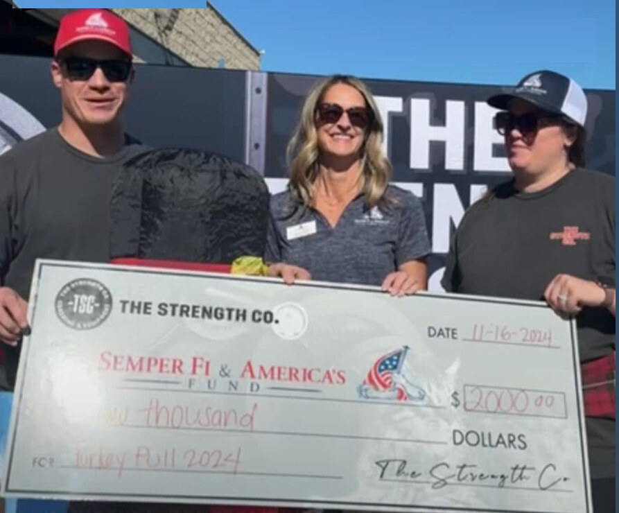 Presenting the $2,000 Turkey Pull 2024 check to the Semper Fi & America's Fund